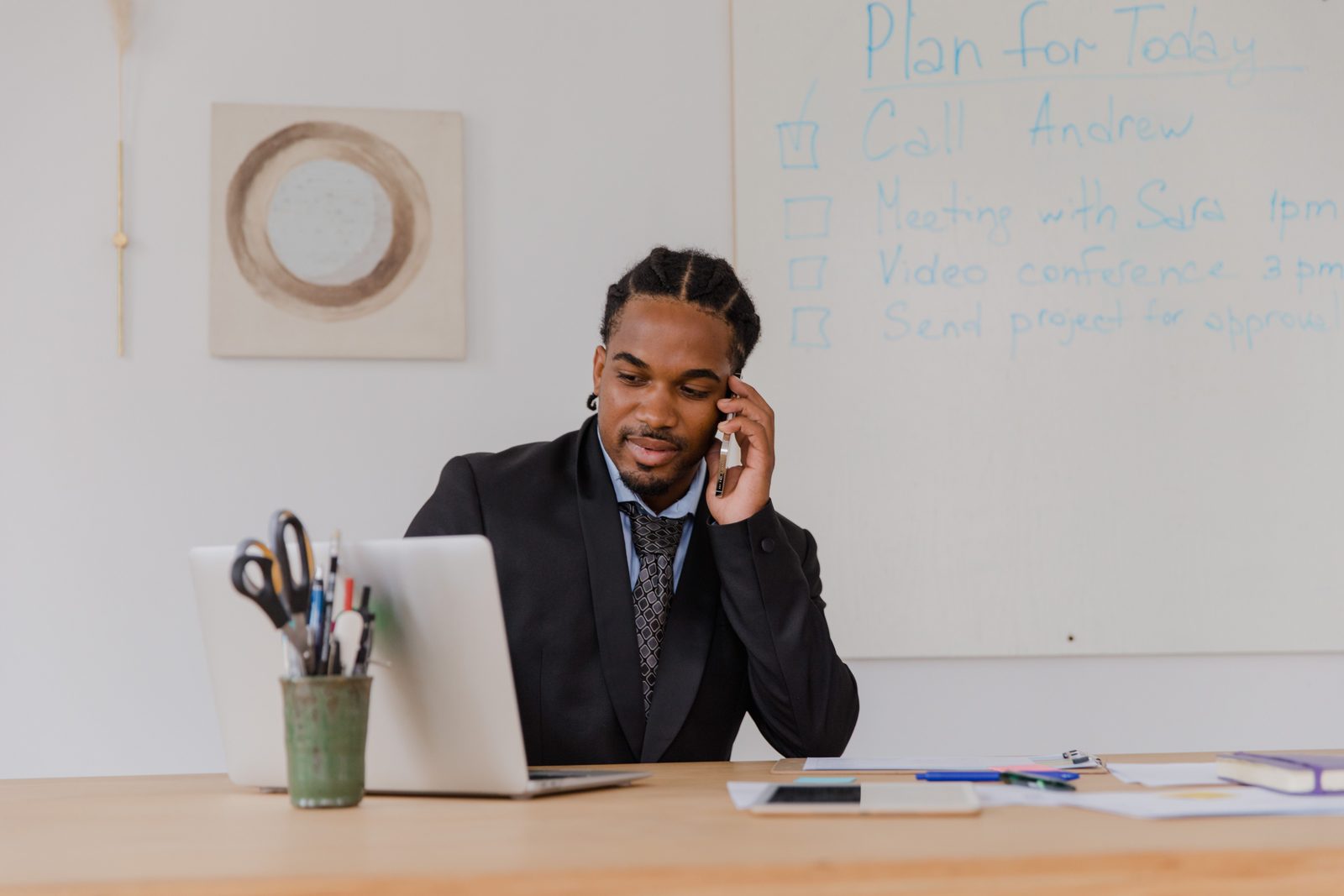 Real estate agent on a phone call in a modern office
